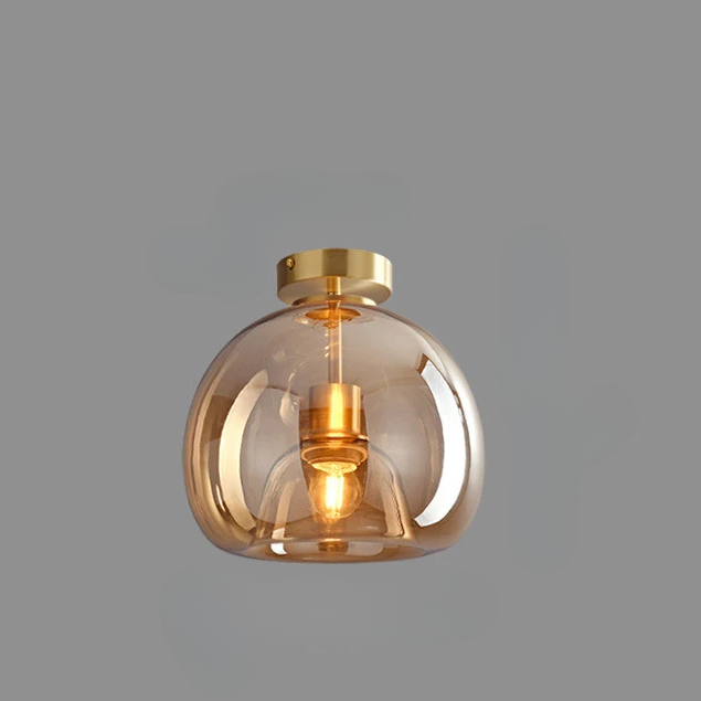 Plafonnier champignon LED en verre ambré sur fond gris